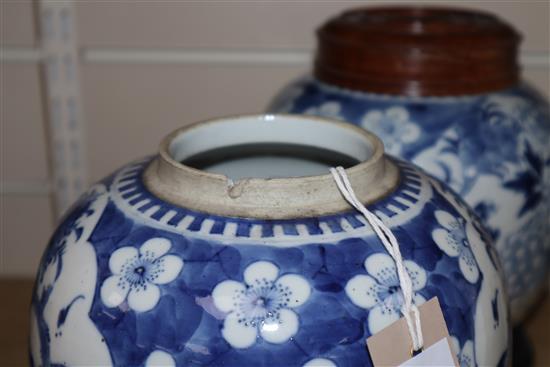 Two Chinese blue and white jars and covers and a pair of hardwood stands